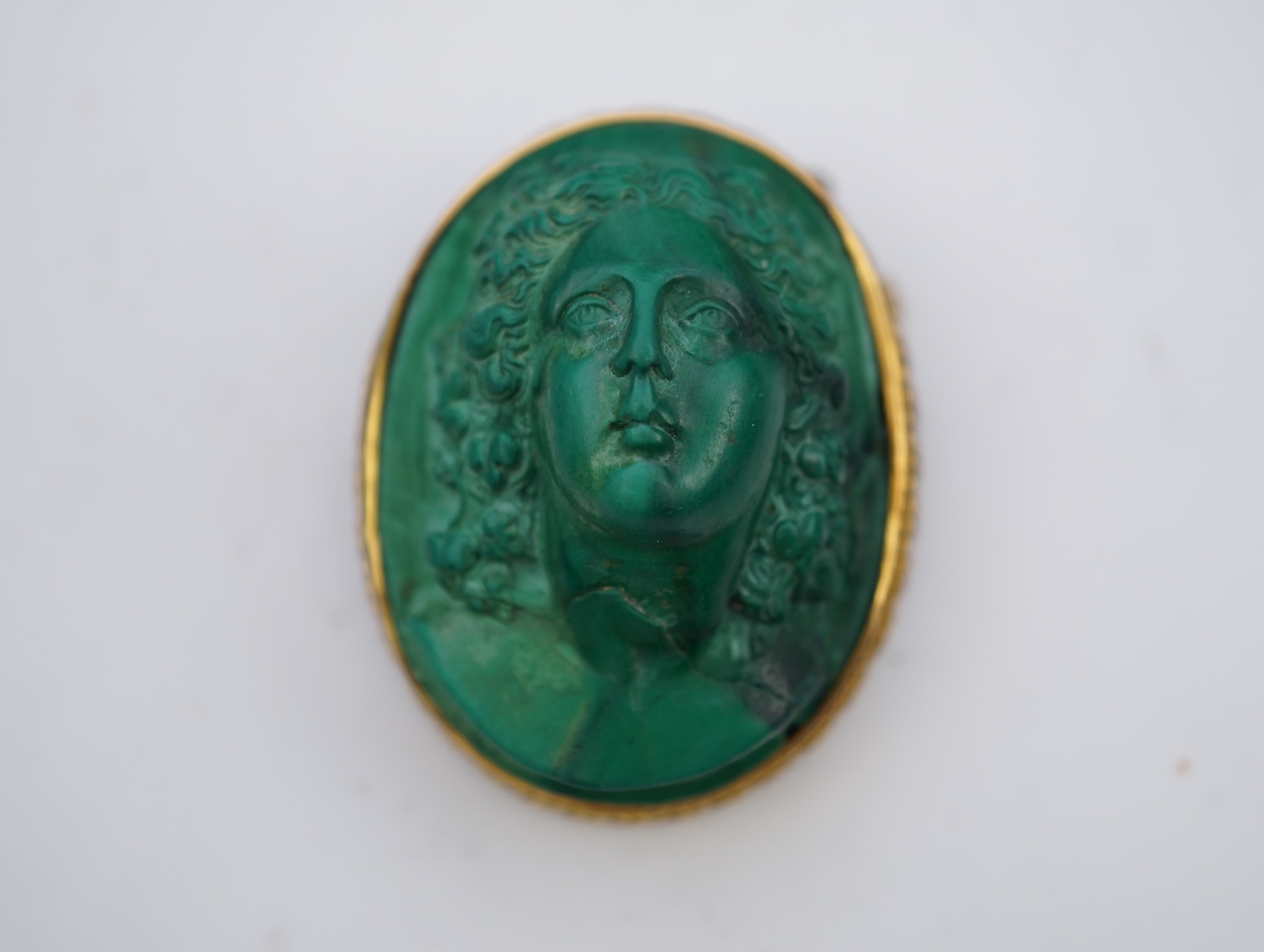 A malachite cameo brooch, mid 19th century